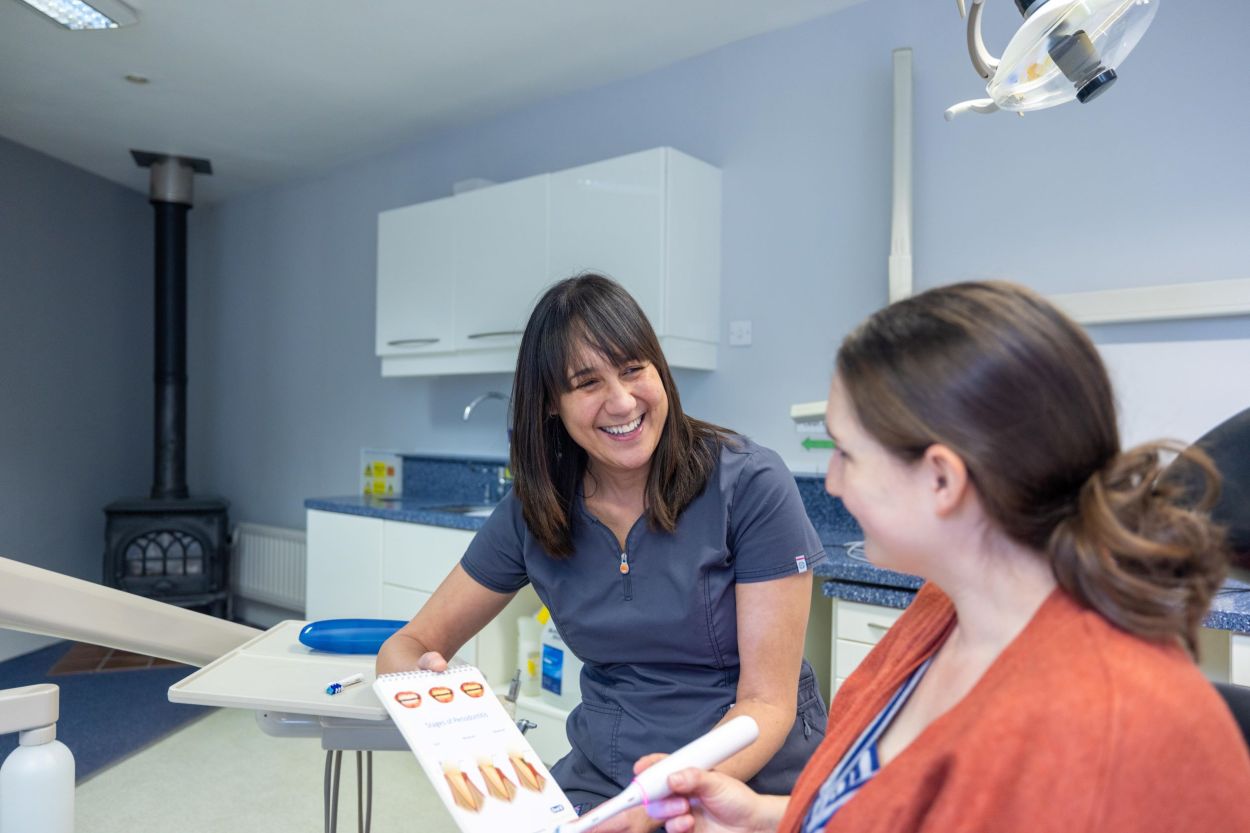 Dentist talking with a patient at Envisage Dental Emsworth